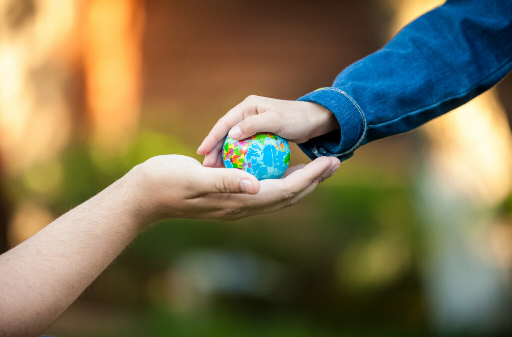 gifford roth tokyo japan hands holding planet earth scaled.jpg